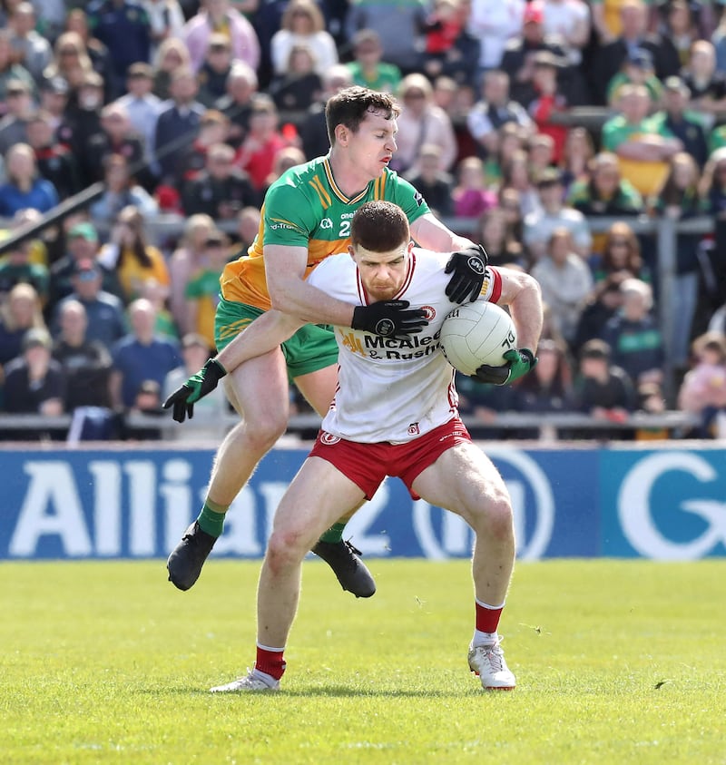 Cathal McShane holds possession under pressure from Jamie Brennan. Picture: Margaret McLaughlin