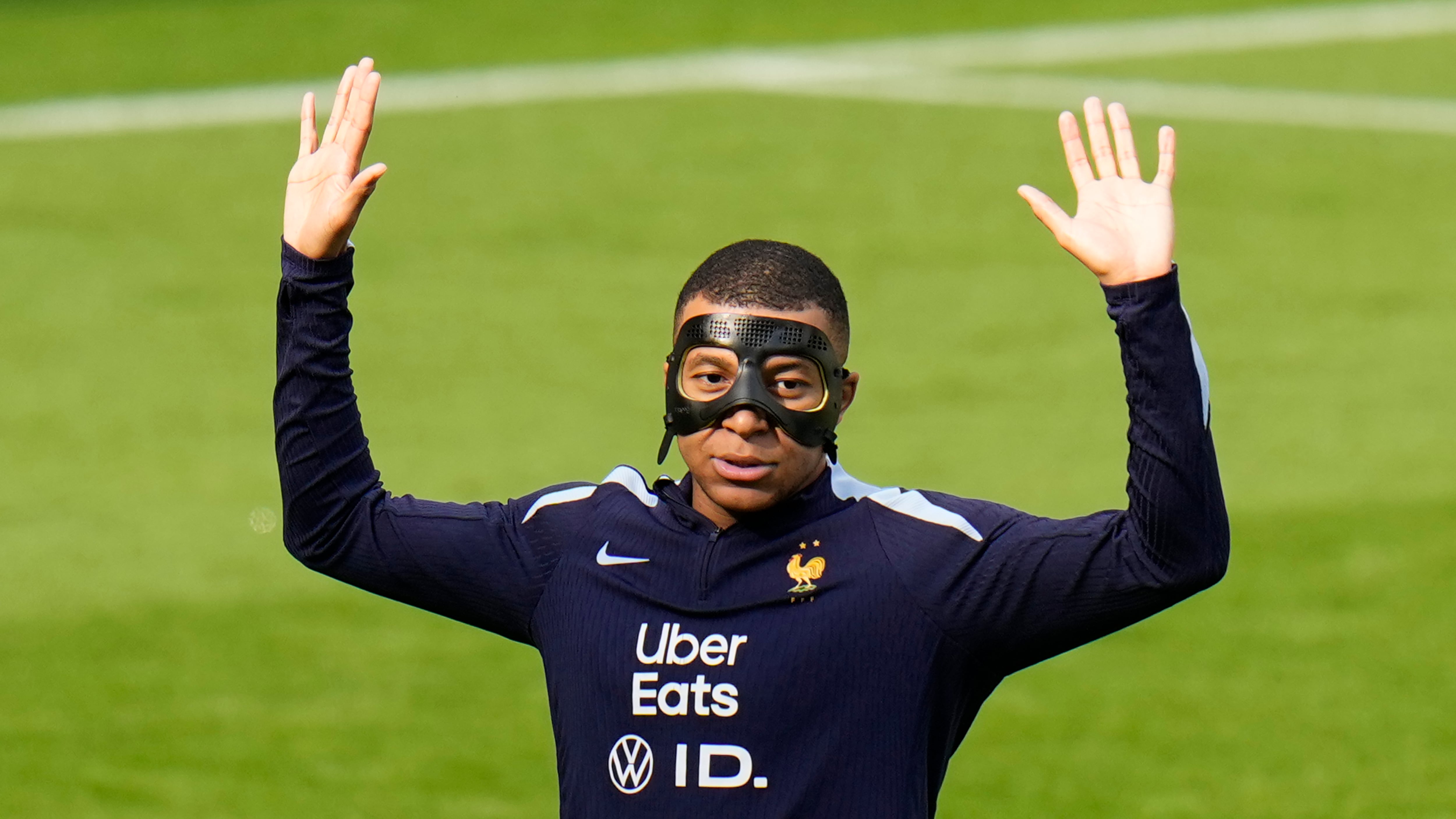 Kylian Mbappe could feature against Poland wearing a protective mask (Hassan Ammar/AP)