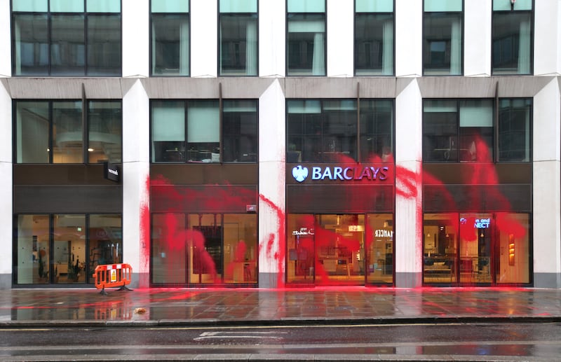 Images sent by Palestine Action show red paint scrawled over the front of a branch in Moorgate, London.