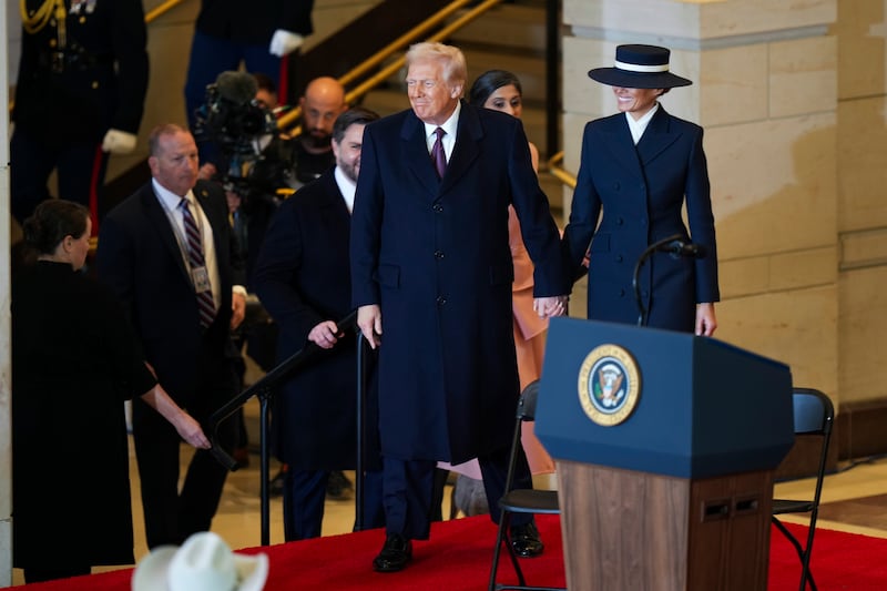 President Donald Trump and first lady Melania Trump arrive to speak at Emancipation Hall after the 60th Presidential Inauguration at the US Capitol in Washington (Angelina Katsanis/Pool Photo Photo via AP)