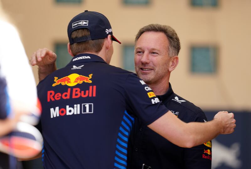 Red Bull Racing’s Max Verstappen (left) embraces team principal Christian Horner
