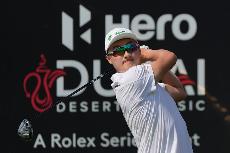 Li Haotong holds a share of the lead in the first round of the Hero Dubai Desert Classic (Kamran Jebreili/AP)