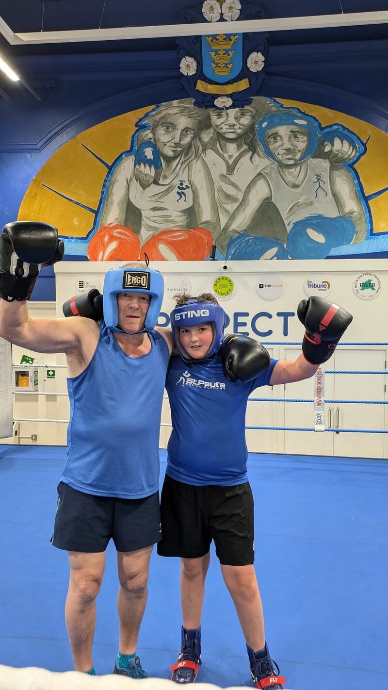 Richard Longthorpe in the boxing ring with his grandson