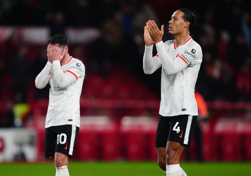 Alexis Mac Allister and Virgil van Dijk react following the draw