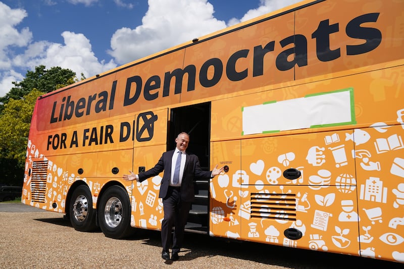 Liberal Democrat leader Sir Ed Davey with his party’s General Election campaign battlebus, dubbed Yellow Hammer 1