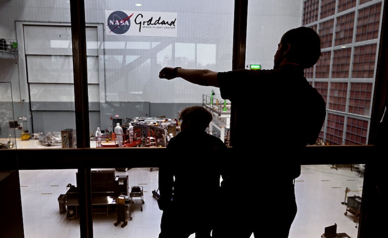 Jane Rigby and Josh Schlieder look out above the assembly area of the Nancy Grace Roman Telescope. PICTURE: Michael S. Williamson/The Washington Post