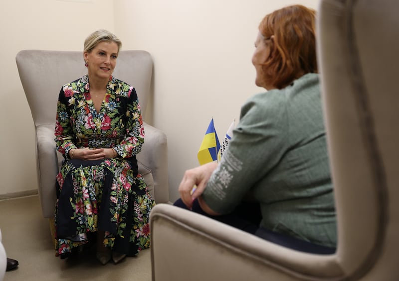 The Duchess of Edinburgh talks to a woman affected by the war