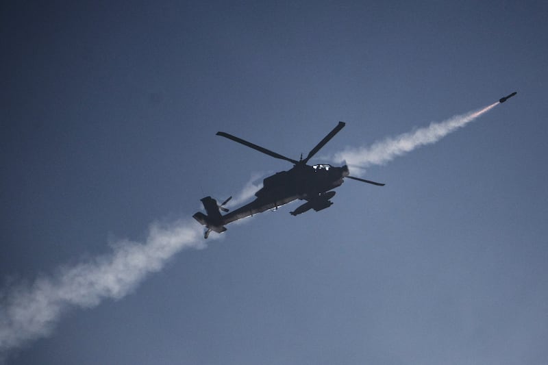 An Israeli helicopter fires a missile towards southern Lebanon (Leo Correa/AP)