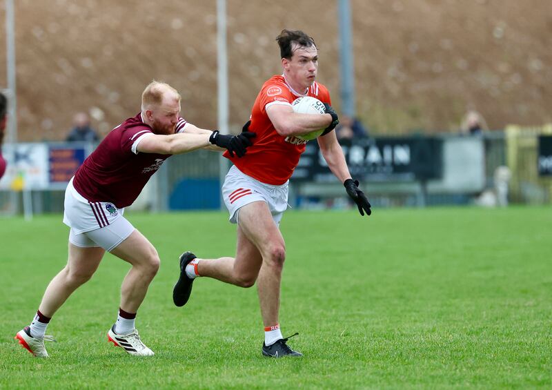 Ballymacnab’s Oisin McGivern  and  Clann Eireann’s Barry McCambridge  during Sunday’s game at Pearse Og Park.
PICTURE COLM LENAGHAN