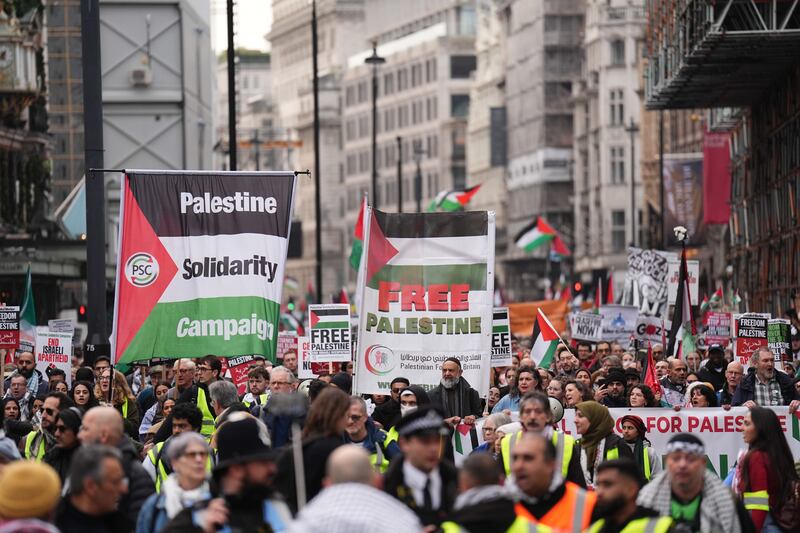 People take part in a Palestine Solidarity Campaign rally in central London