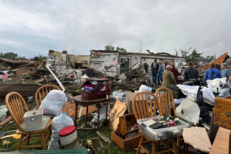 People examine damage after the tornado ripped through Greenfield, Iowa (Hannah Fingerhut/AP)