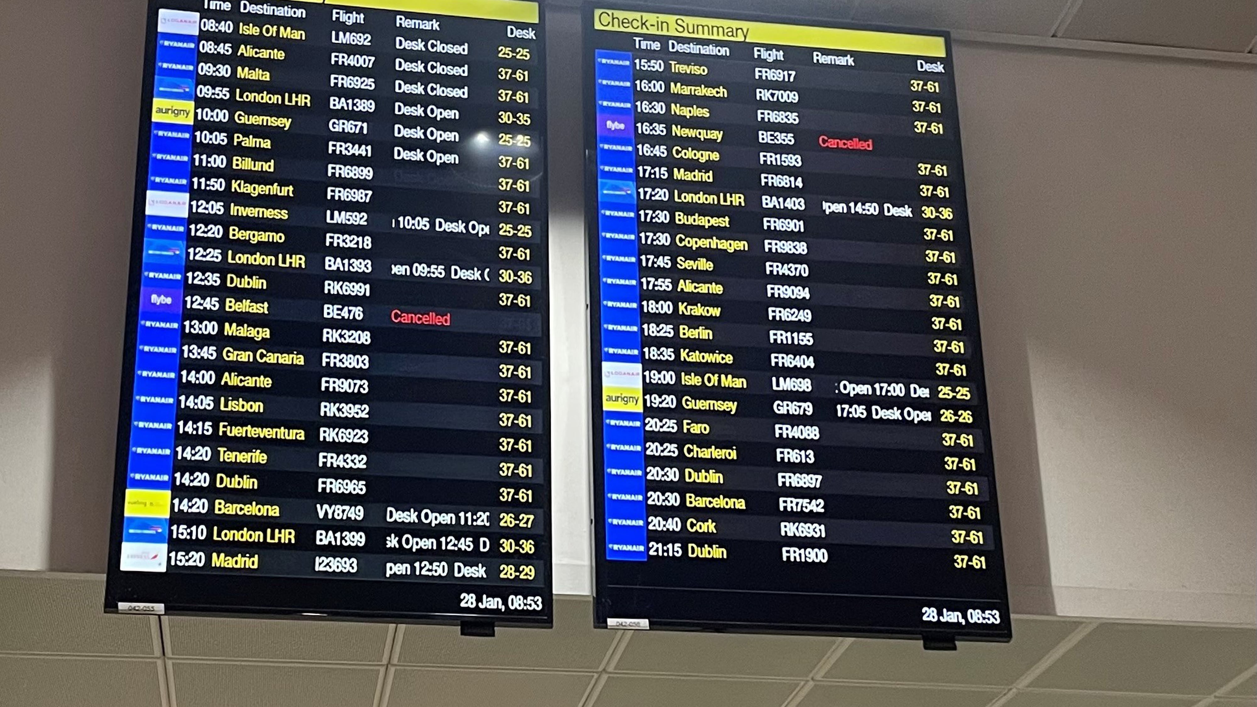 File photo of departure boards at Manchester Airport