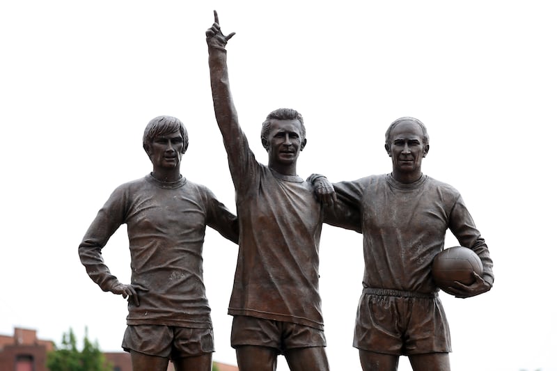 A statute of George Best, Law and Bobby Charlton, Manchester United’s ‘Holy Trinity’, stands outside Old Trafford .