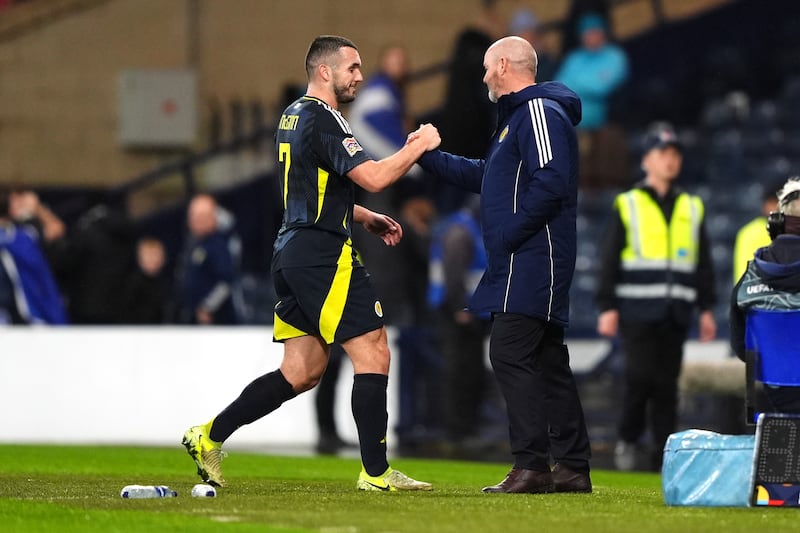 John McGinn, left, is congratulated by manager Steve Clarke after scoring Scotland’s winner