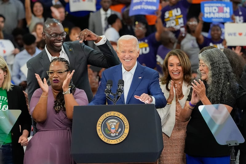 President Joe Biden smiles after delivering his remarks at Renaissance High School in Detroit (Carlos OsorioAP)