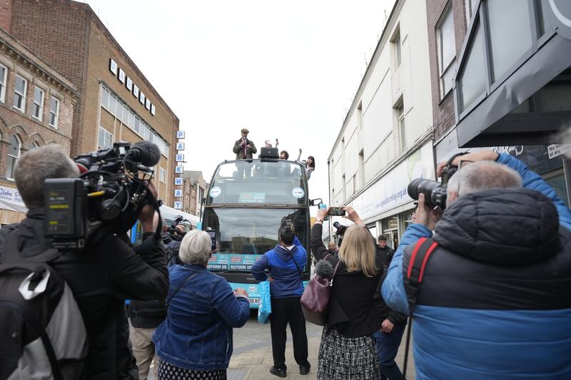 Reform UK leader Nigel Farage makes a speech on the Reform UK campaign bus in Barnsley, South Yorkshire