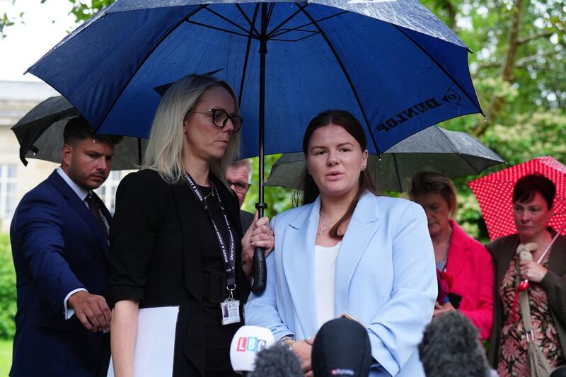 Sharlona Warner, front right, the mother of eight-month-old Zackary Blades, speaks to the media alongside Detective Constable Natalie Horner outside Durham Crown Court
