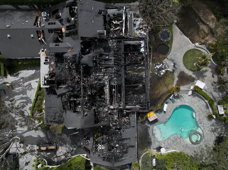 An aerial view shows a fire-damaged property, which appears to belong to Cara Delevingne, in the Studio City section of Los Angeles (Jae C Hong/AP)