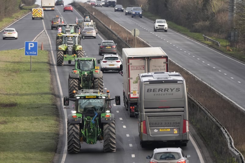 Farmers in tractors make their way along the A303 near Andover, Hampshire