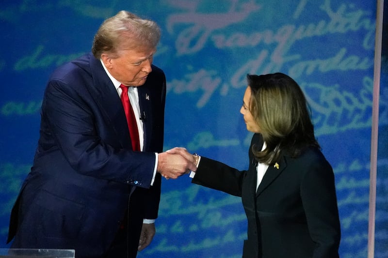 Republican presidential nominee former President Donald Trump shakes hands with Democratic presidential nominee Vice President Kamala Harris (Alex Brandon/AP)