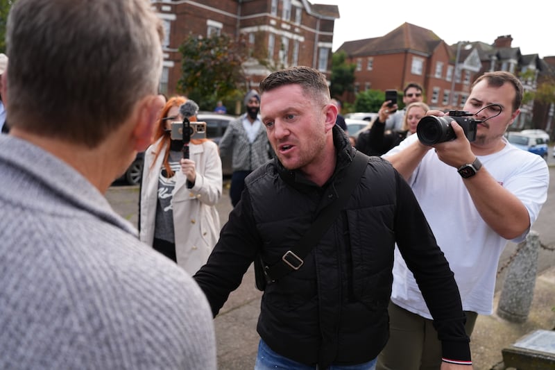 Political activist Tommy Robinson outside Folkestone Police Station on Friday