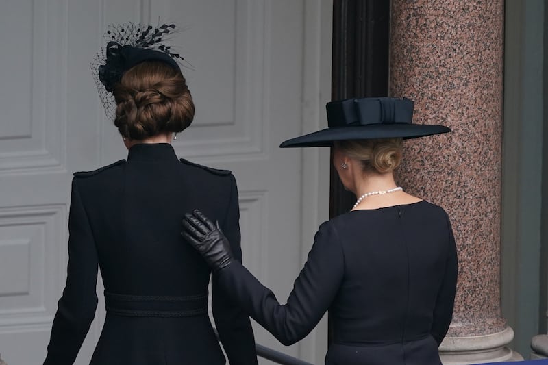 Sophie placed her hand on the the princess’s back as they departed