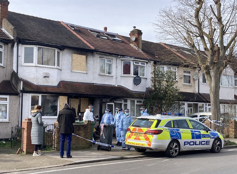 Forensic officers at the scene of the fatal fire in Streatham, south London