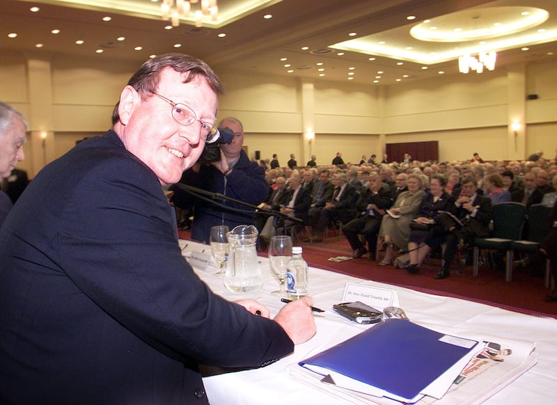 Ulster Unionist Leader David Trimble takes his seat at the meeting of the Ulster Unionist Council in Belfast.