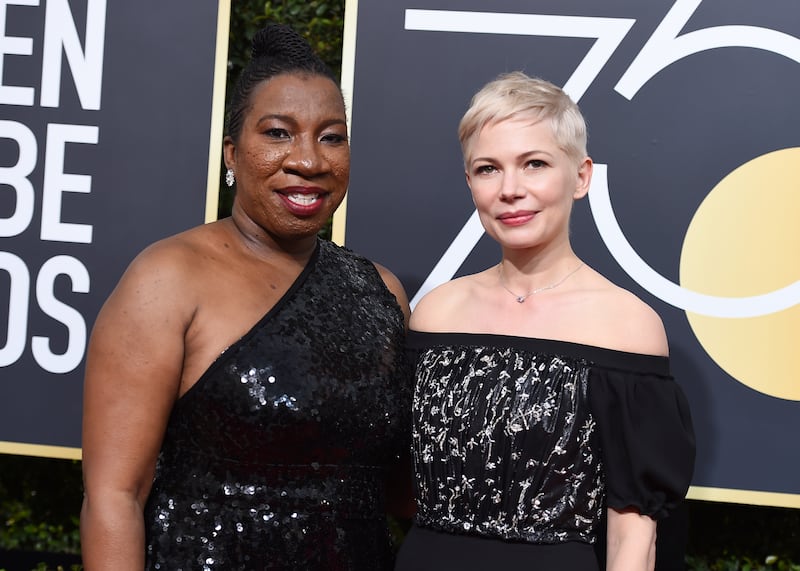 Tarana Burke, left, and Michelle Williams arrive at the 75th annual Golden Globe Awards (Jordan Strauss/Invision/AP)