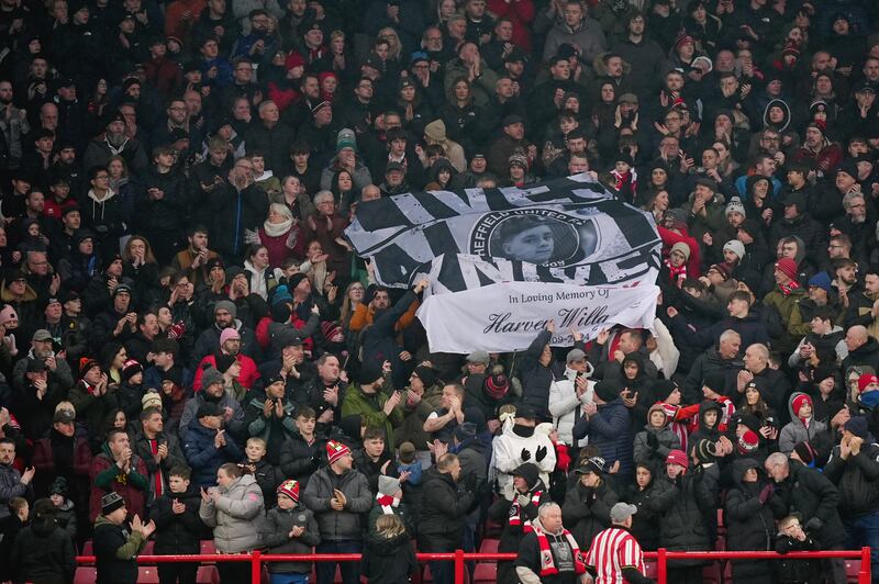 Fans held up a banners inside the stadium