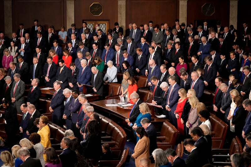 Members bow their heads during a moment of silence for the victims of the attack in New Orleans as the House of Representatives meets to elect a speaker and convene the new 119th Congress at the Capitol in Washington (Mark Schiefelbein/AP)