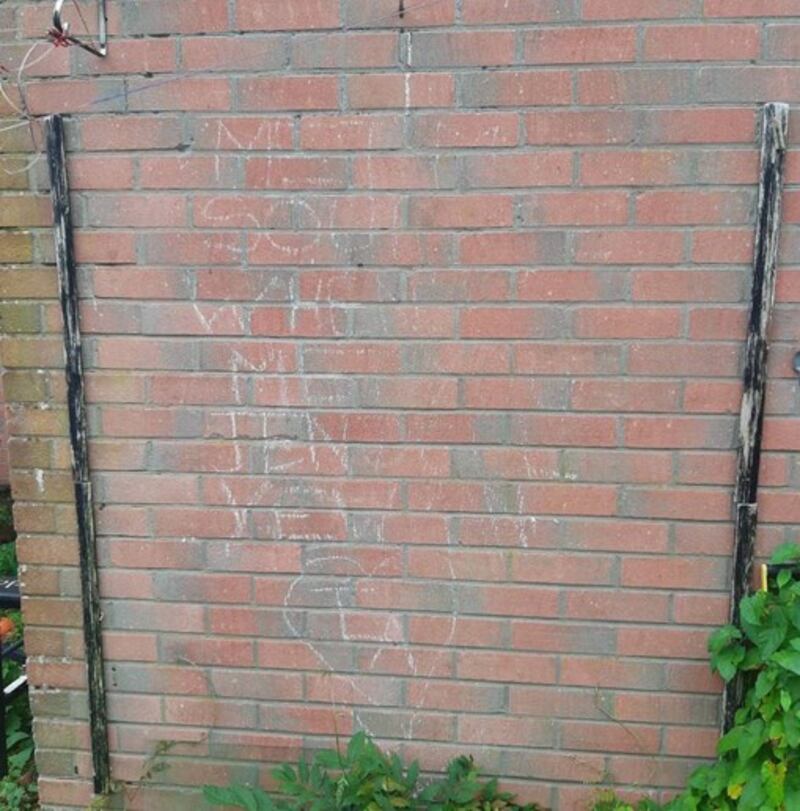 Chalk graffiti by Anthony Yewman on the wall of Jenny Dalton’s home.