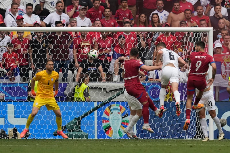 Serbia’s Luka Jovic, centre, heads home in stoppage time (Antonio Calanni/AP)