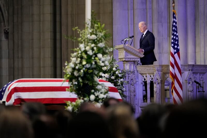 President Joe Biden speaks next to the flag-draped casket of Jimmy Carter (Ben Curtis/AP)