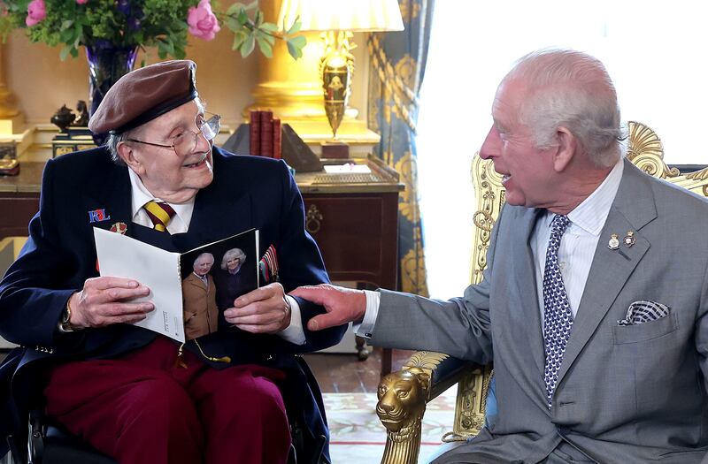 D-Day veteran Jim Miller receives his 100th birthday card from the King