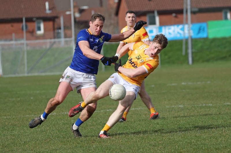 Antrim’s Ryan McQuillan  and Wicklow’s Dean Healy in action during Sunday’s Allianz Football League Roinn 3 game at Corrigan Park in Belfast
PICTURE COLM LENAGHAN