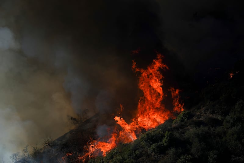 The Palisades Fire continuing to burn on the outskirts of the Pacific Palisades area of Los Angeles on Friday (Eric Thayer/AP)