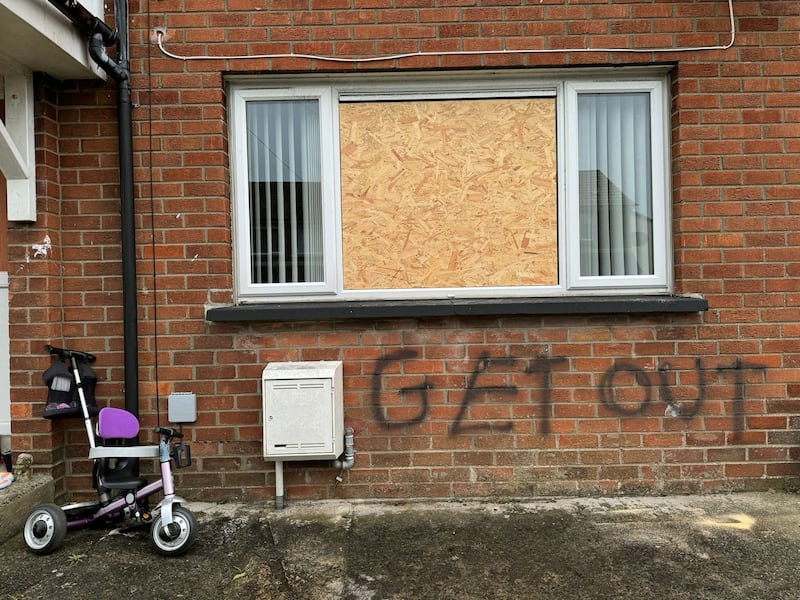 Two windows were also smashed and graffiti sprayed at a property in the Cedric Street area of Larne in what police are treating as a racially-motivated hate crime. PICTURE: MAL MCCANN