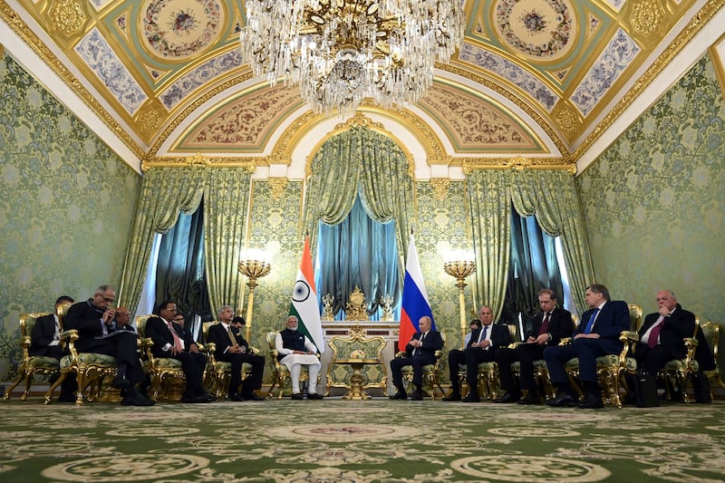 Indian Prime Minister Narendra Modi and Russian President Vladimir Putin speak during a meeting at the Kremlin (Sergei Bobylev, Sputnik, Kremlin Pool Photo via AP)