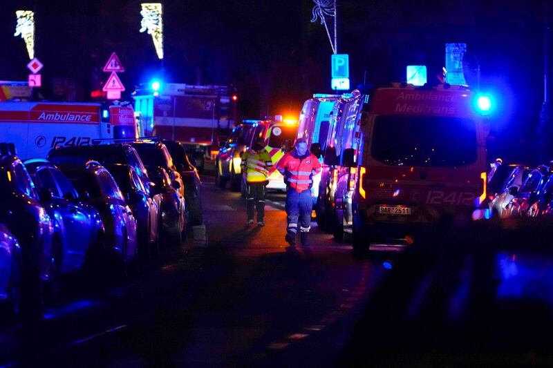 Emergency services near the building of Philosophical Faculty of Charles University in Prague (Petr David Josek/AP)