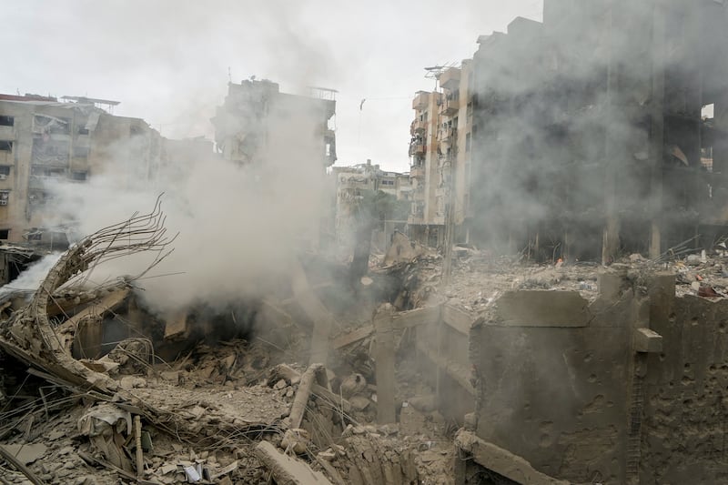 Smoke rises from destroyed buildings at the site of an Israeli air strike in Choueifat, south-east of Beirut (Bilal Hussein/AP)