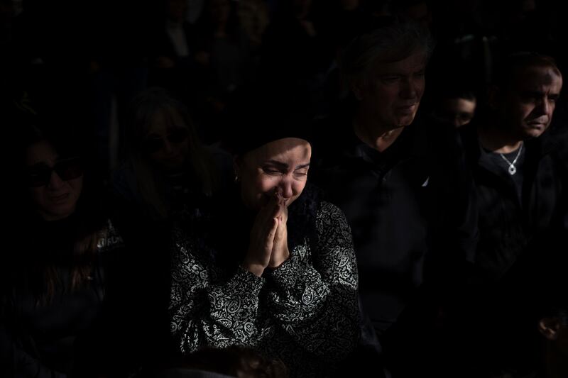 Family and friends of an Israeli soldier mourn over his grave during his funeral at Kiryat Shaul cemetery in Tel Aviv (AP Photo/Oded Balilty)