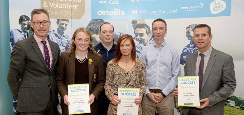 Cross and Passion College&rsquo;s Senior Camogs win a Special Team Achievement Award for their sporting accomplishments during the academic year while taking part in the Irish News and Performa Sports Stats for Success initiative. Pictured from left to right is John Brolly of the Irish News, Roisin McCormick (Cross and Passion senior camogie captain), Danny Turley of Performa Sports, Elaine Dowds (teacher at Cross and Passion College), Joe Turley of Performa Sports and Barry Kelly, teacher at Cross and Passion College.