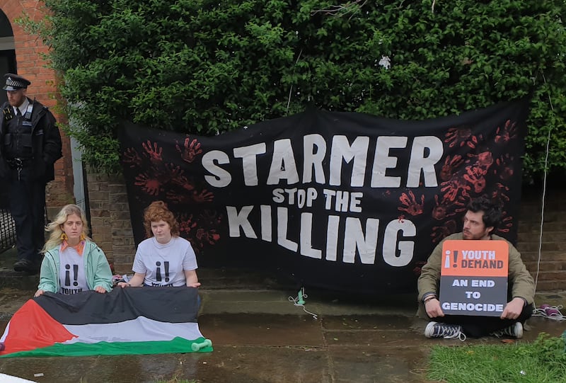 (L to R) Zosia Lewis, Leonorah Ward and Daniel Formentin protesting outside the London home of Labour leader Sir Keir Starmer