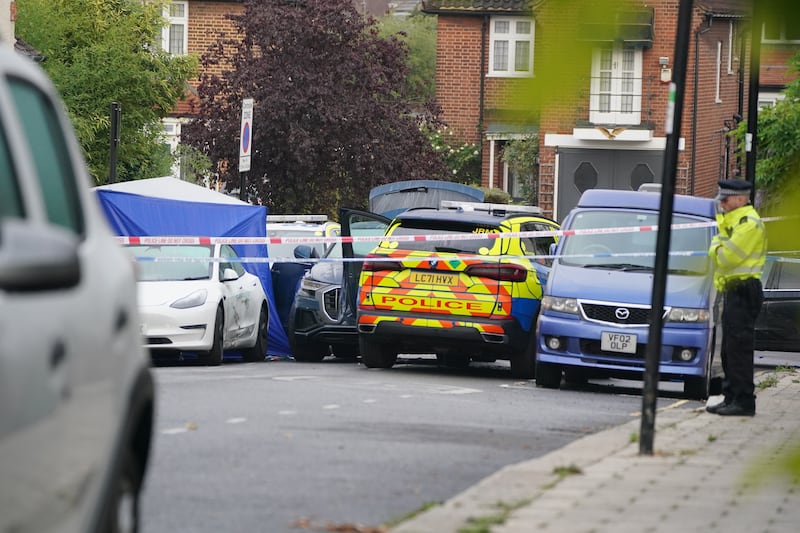 Emergency personnel and vehicles at the scene of the shooting in Streatham, south London