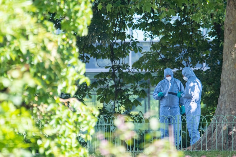 Police forensics officers in Forbury Gardens, Reading