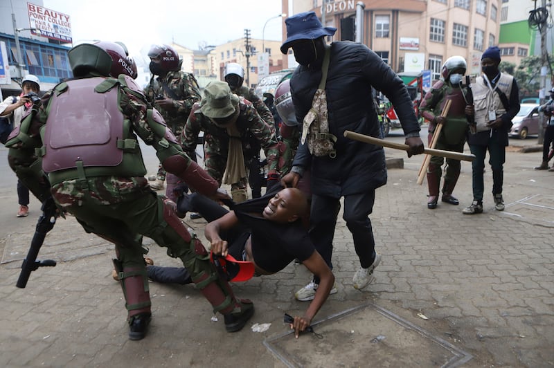 A protester is arrested in Nairobi during a demonstration against hunger (Andrew Kasuku/AP)