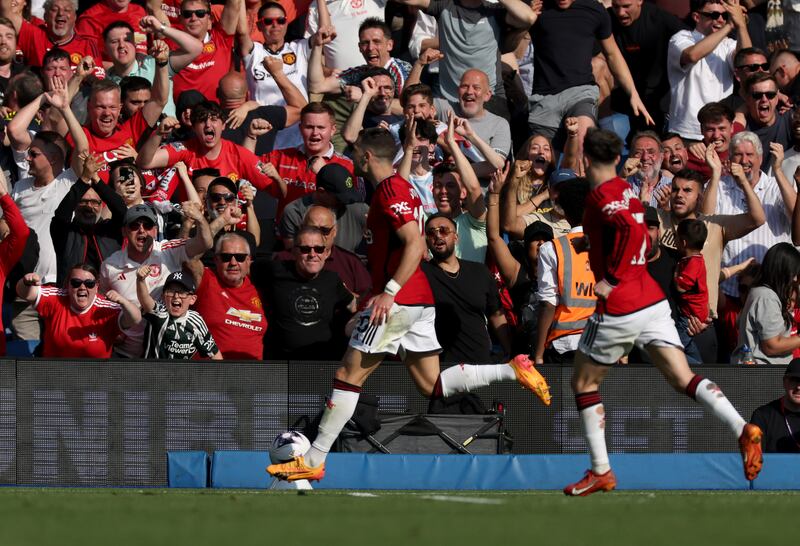 Manchester United’s Diogo Dalot (left) celebrates scoring his side’s first goal of the game during the Premier League match at the Amex Stadium, Brighton