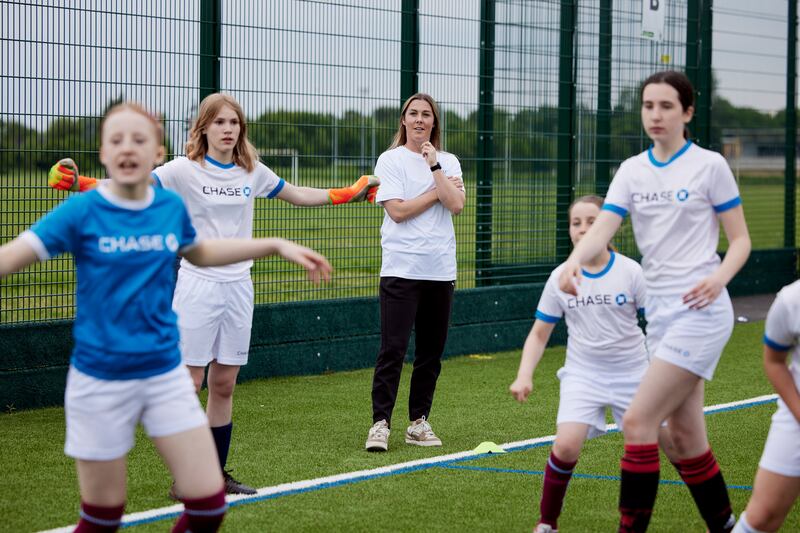 Earps (centre) is supporting a grassroots coaching initiative