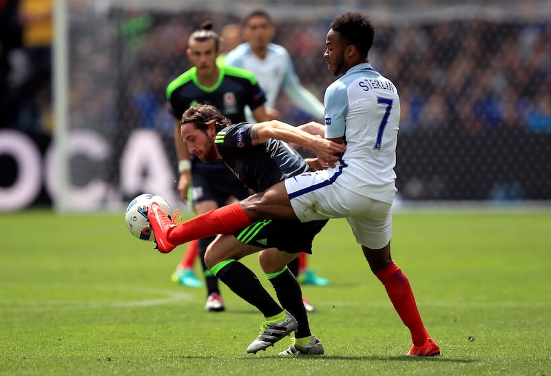 Allen, pictured in action against England at Euro 2016, has been one of Wales’ midfield greats